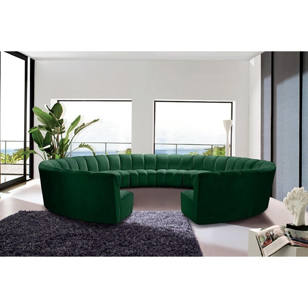 Large green velvet round couch.