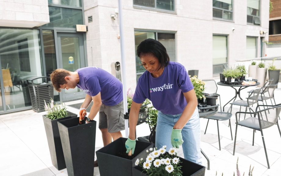 Wayfair employees gardening to help beautify the John and Jill Ker Conway Residence.