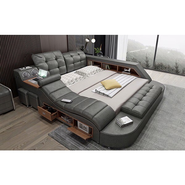 Large Leather bed with Lounge chair and various gadgets attached to it.