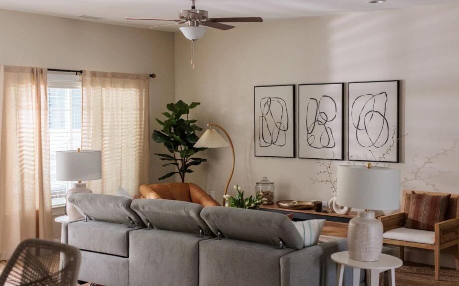 The living room in Rebecca's new home, with a brand new adjustable sectional and lift top coffee table.