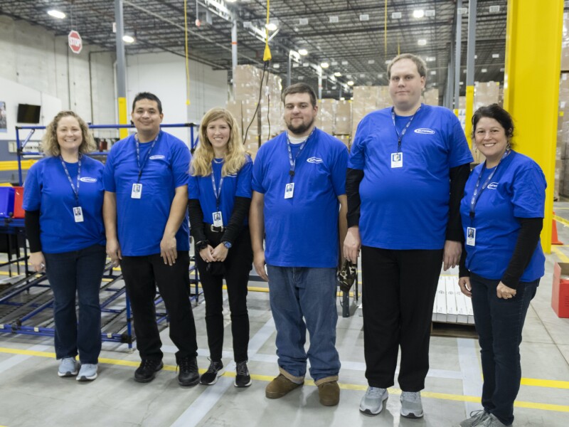 Employees Posing in Warehouse