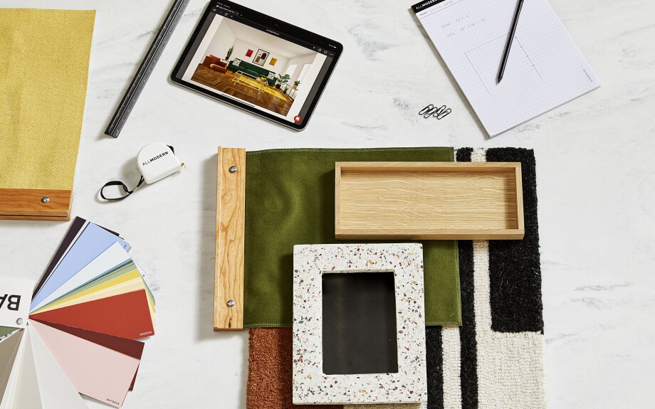 A top-down look onto a marble topped table. The table is displayed with color & fabric swatches of various styles to provide decor inspiration.