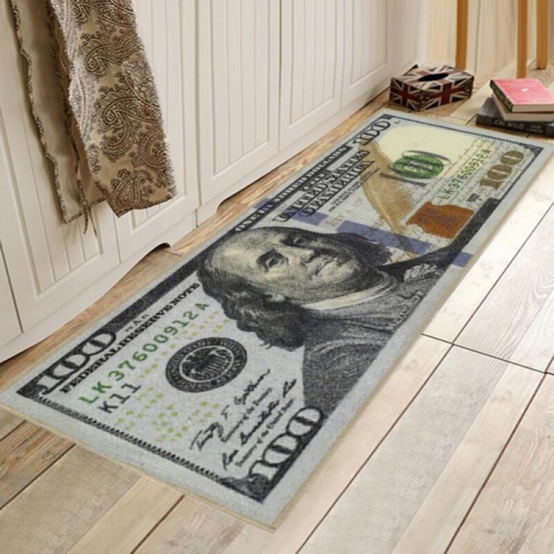 $100 bill themed rug in front of white door in hallway.