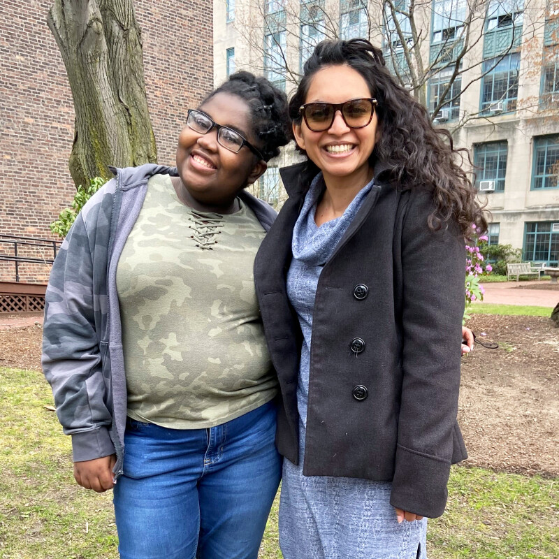Two people smiling for the camera.