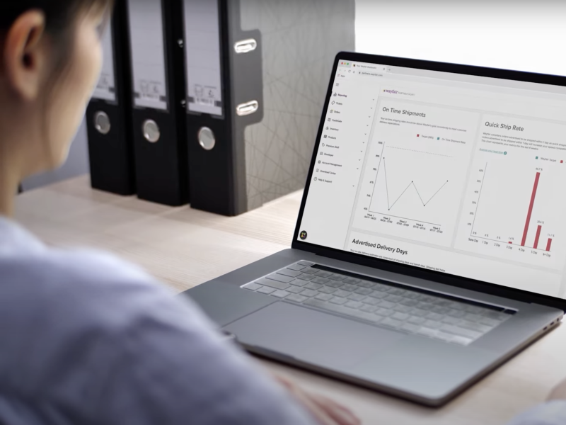 Image of Supplier on laptop viewing graphs from Partner Home and online fulfillment