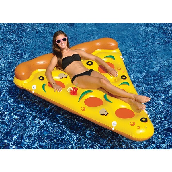 Woman in a black swimsuit lounging on a pizza-shaped pool float.