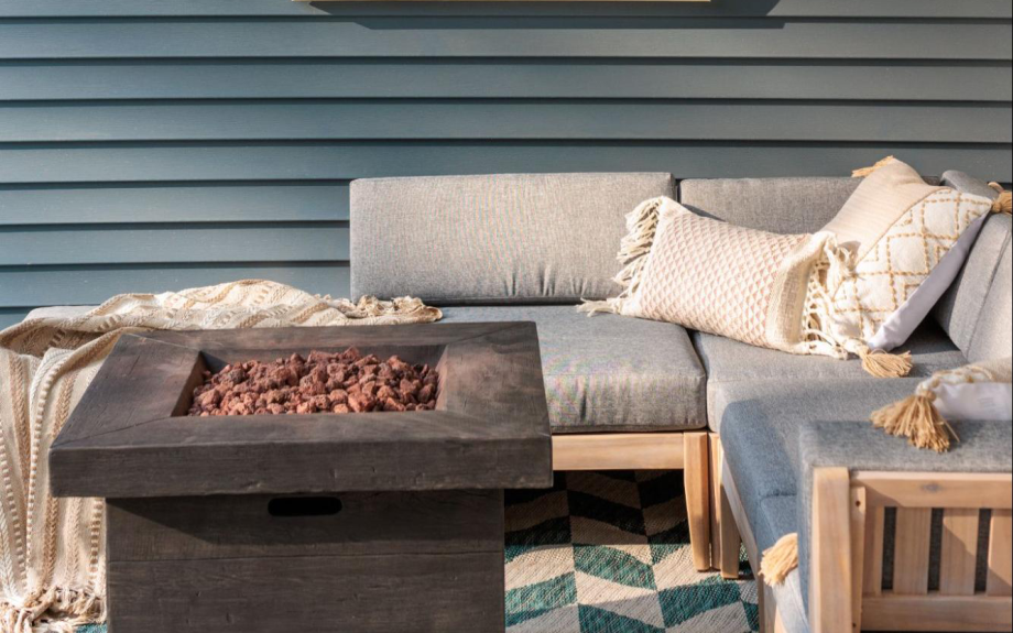 An outdoor space outfitted with a fire pit to keep Rebecca's friends and family warm.